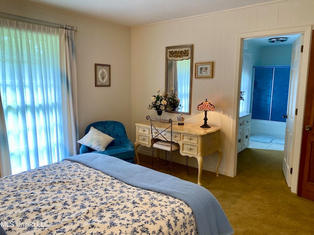 bedroom with connected bathroom, carpet, multiple windows, and ornamental molding