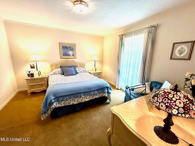 carpeted bedroom featuring ornamental molding and a textured ceiling