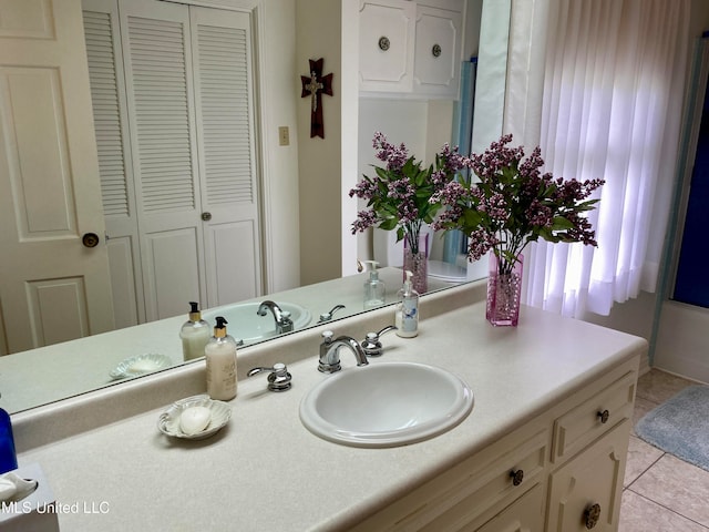 bathroom with vanity and tile patterned flooring