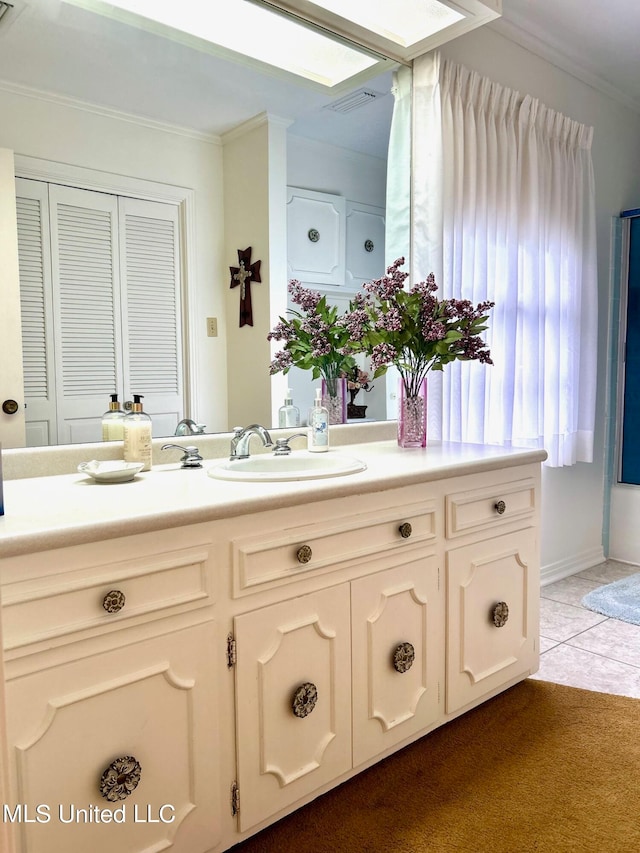 bathroom with vanity and crown molding