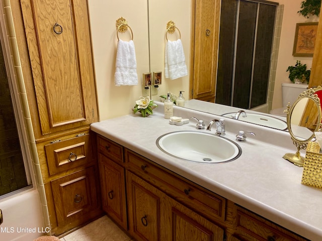 full bathroom with vanity, shower / tub combination, and toilet