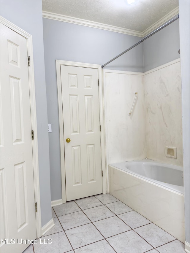 bathroom with tile patterned floors, crown molding, a textured ceiling, and tub / shower combination