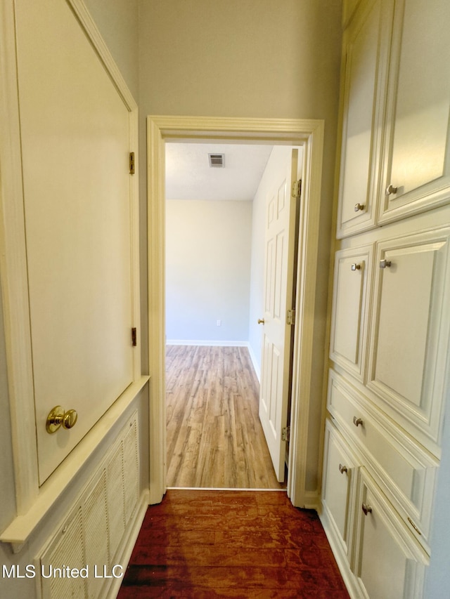 hallway featuring hardwood / wood-style flooring