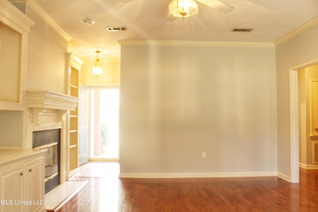 unfurnished living room featuring hardwood / wood-style floors, ceiling fan, and ornamental molding