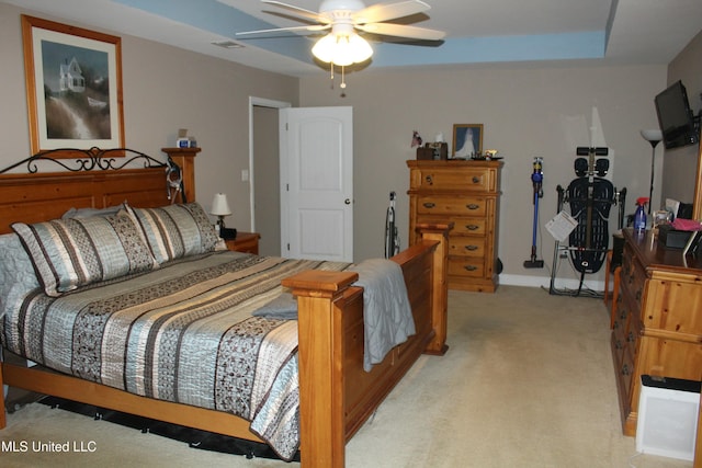 bedroom with light colored carpet and ceiling fan