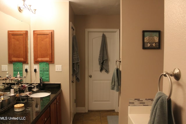 bathroom featuring tile patterned flooring and vanity