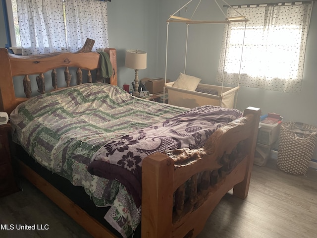 bedroom featuring wood finished floors