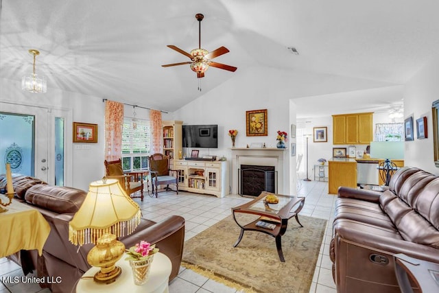 99102 Koloa St, Diamondhead, MS 39525 - living area with vaulted ceiling, ceiling fan, and light tile patterned floors