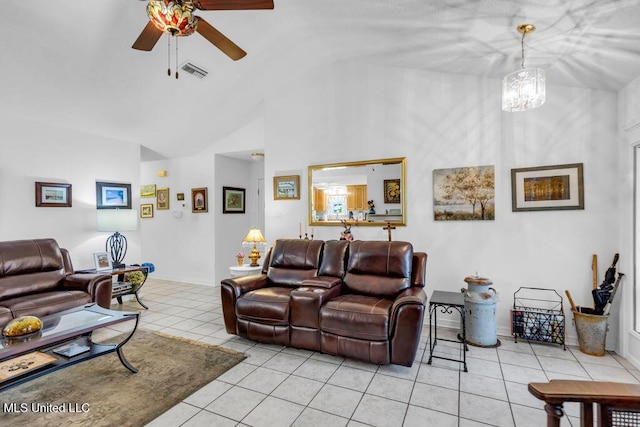 99102 Koloa St, Diamondhead, MS 39525 - living area with light tile patterned floors, vaulted ceiling, a ceiling fan, and a chandelier