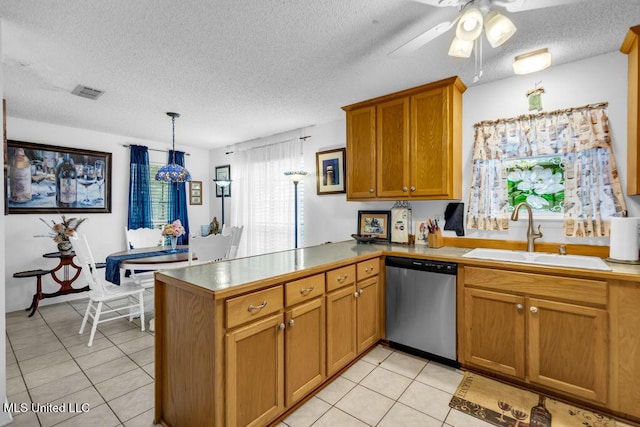 99102 Koloa St, Diamondhead, MS 39525 - kitchen featuring stainless steel dishwasher, a peninsula, light tile patterned floors, a textured ceiling, and a ceiling fan
