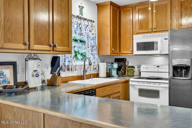 99102 Koloa St, Diamondhead, MS 39525 - kitchen with white appliances and brown cabinetry