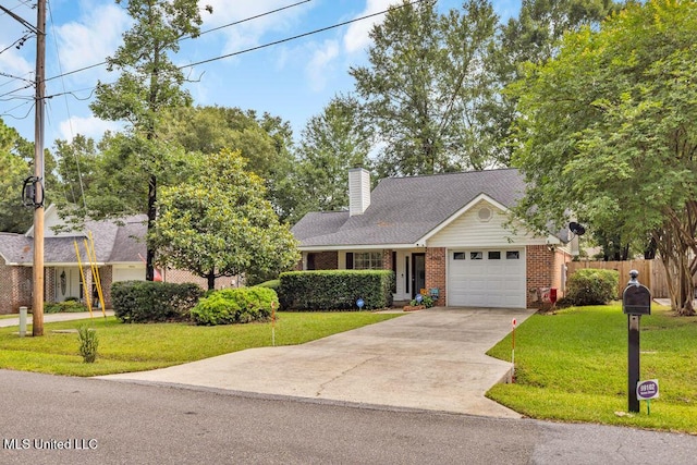 99102 Koloa St, Diamondhead, MS 39525 - view of front facade featuring an attached garage, concrete driveway, brick siding, and a chimney