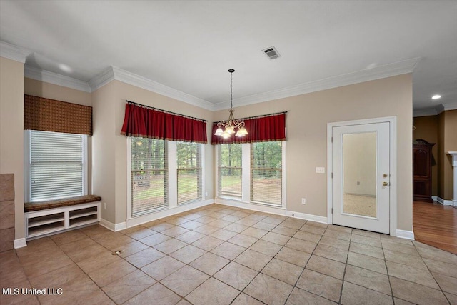 unfurnished dining area with light tile patterned floors, visible vents, ornamental molding, and an inviting chandelier