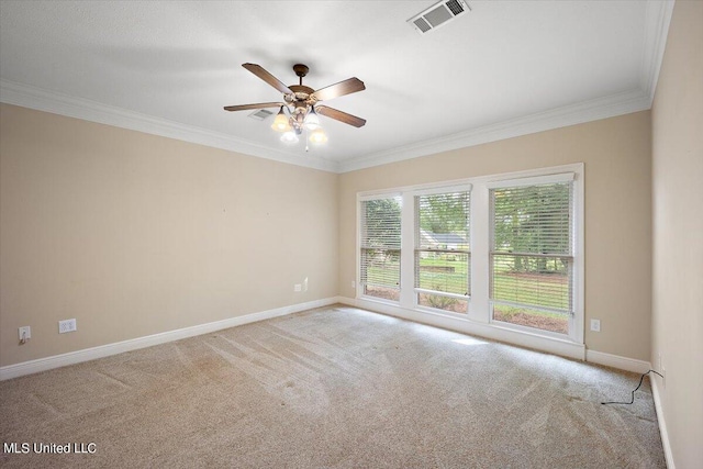 empty room with crown molding, light colored carpet, and ceiling fan