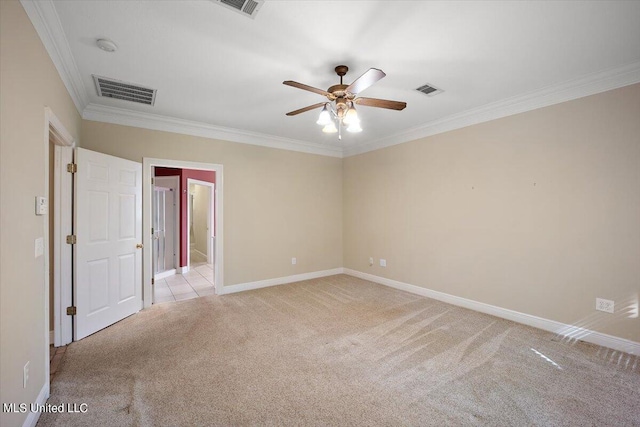 empty room featuring light carpet, ornamental molding, and ceiling fan