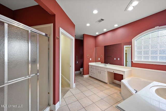 full bathroom featuring vanity, independent shower and bath, toilet, and tile patterned floors