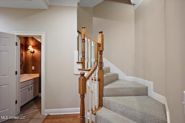 stairway featuring tile patterned flooring