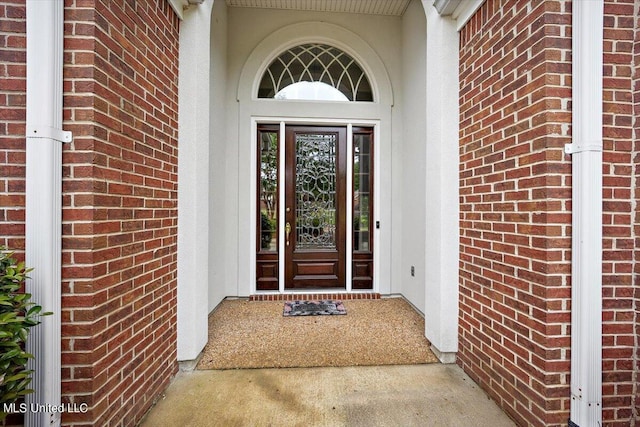 entrance to property with brick siding