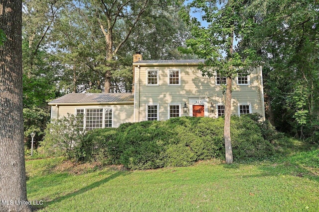 223 Hannah Dr, Clinton, MS 39056 - colonial home featuring a chimney and a front lawn