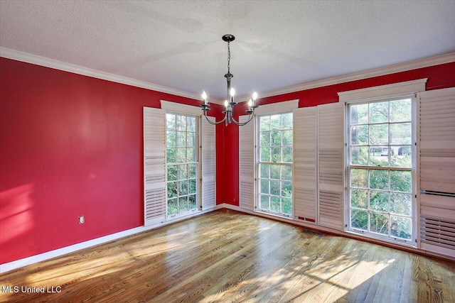 223 Hannah Dr, Clinton, MS 39056 - unfurnished room with a chandelier, wood finished floors, crown molding, a textured ceiling, and healthy amount of natural light
