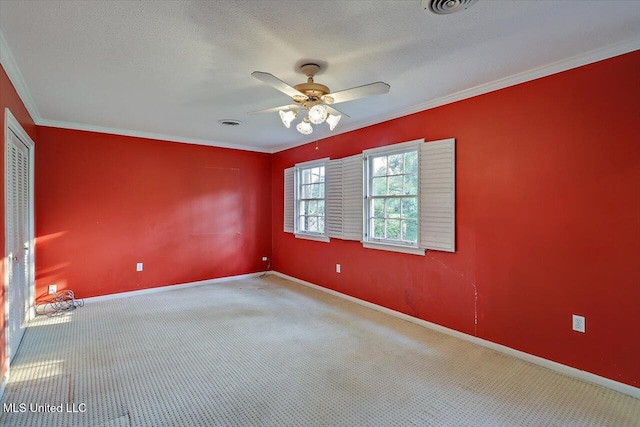 223 Hannah Dr, Clinton, MS 39056 - empty room featuring a ceiling fan, carpet, crown molding, and baseboards