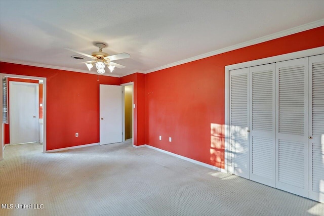 223 Hannah Dr, Clinton, MS 39056 - unfurnished bedroom with baseboards, carpet, crown molding, a closet, and ceiling fan