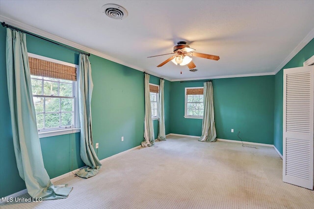 223 Hannah Dr, Clinton, MS 39056 - unfurnished bedroom featuring ornamental molding, baseboards, carpet flooring, and a ceiling fan