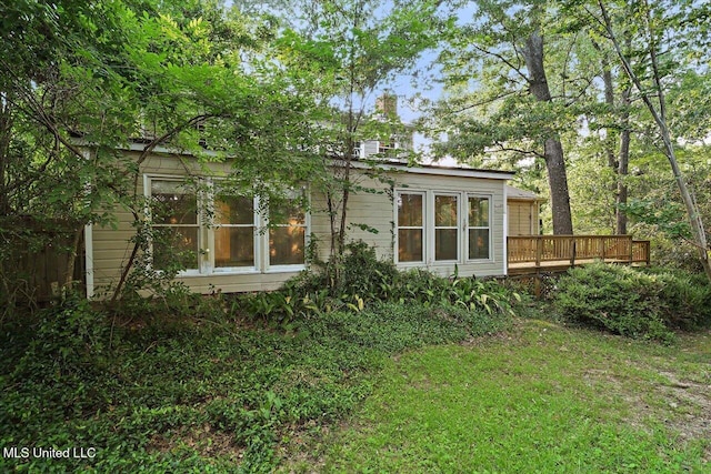 223 Hannah Dr, Clinton, MS 39056 - rear view of house with a wooden deck and a chimney