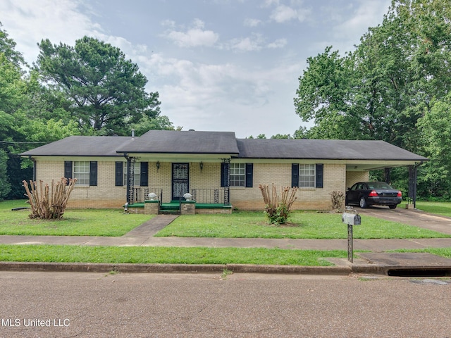 512 Saint Paul Ave, Senatobia, MS 38668 - ranch-style home featuring brick siding, asphalt driveway, covered porch, and a front lawn
