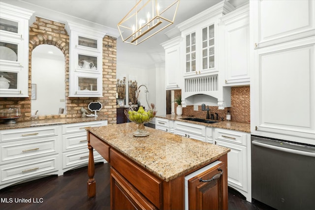 kitchen with decorative backsplash, sink, decorative light fixtures, white cabinets, and dark hardwood / wood-style floors