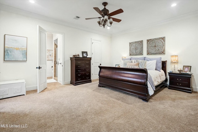 bedroom featuring ceiling fan, crown molding, ensuite bathroom, and light carpet