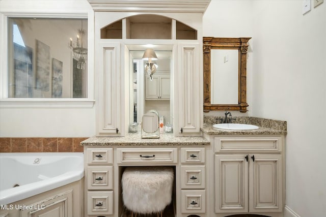 bathroom featuring vanity and a bathtub