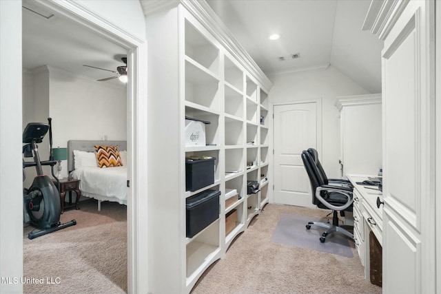 carpeted office space with ceiling fan, lofted ceiling, and ornamental molding