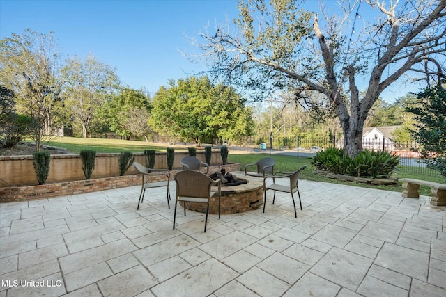 view of patio with an outdoor fire pit