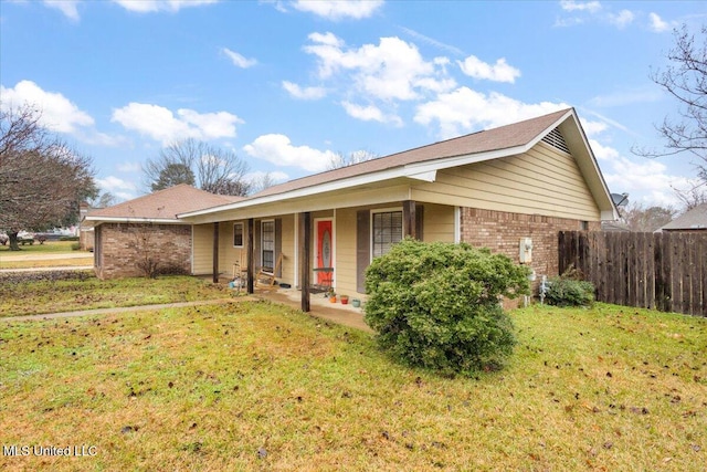 ranch-style house featuring a front yard and a porch