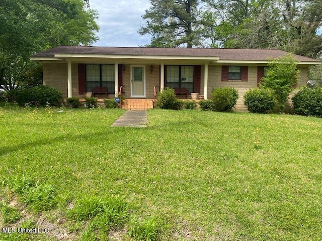 22 N Joliffe St, Eupora, MS 39744 - single story home featuring covered porch, a front lawn, and brick siding