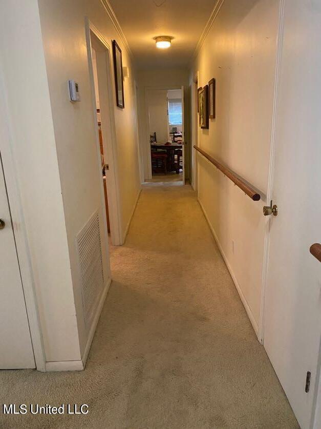 22 N Joliffe St, Eupora, MS 39744 - hall featuring visible vents, light carpet, and ornamental molding