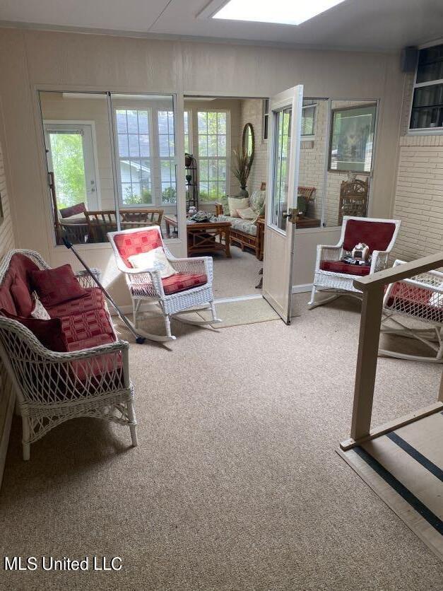 22 N Joliffe St, Eupora, MS 39744 - living room with a skylight and carpet floors