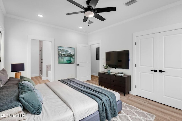 bedroom featuring recessed lighting, a closet, visible vents, ornamental molding, and light wood-style floors