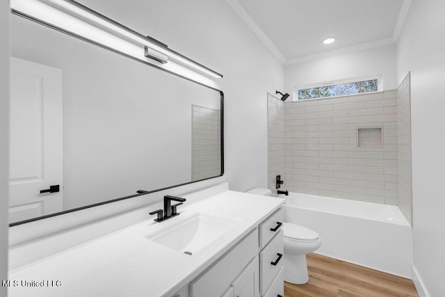 full bathroom featuring toilet, wood finished floors, vanity,  shower combination, and ornamental molding