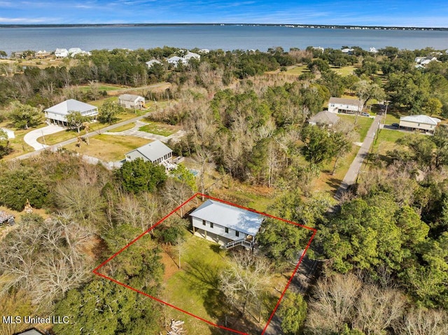 birds eye view of property featuring a water view