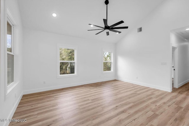 spare room with baseboards, visible vents, ceiling fan, and light wood finished floors