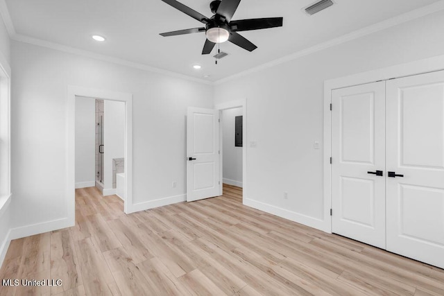 unfurnished bedroom featuring light wood-style floors, baseboards, visible vents, and ornamental molding