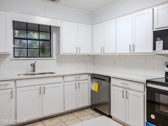 kitchen with dishwasher, range with electric cooktop, sink, light tile patterned flooring, and white cabinets