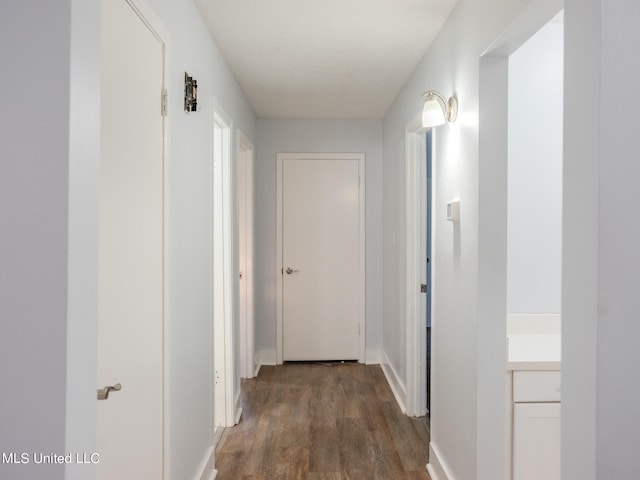 hallway featuring dark hardwood / wood-style floors