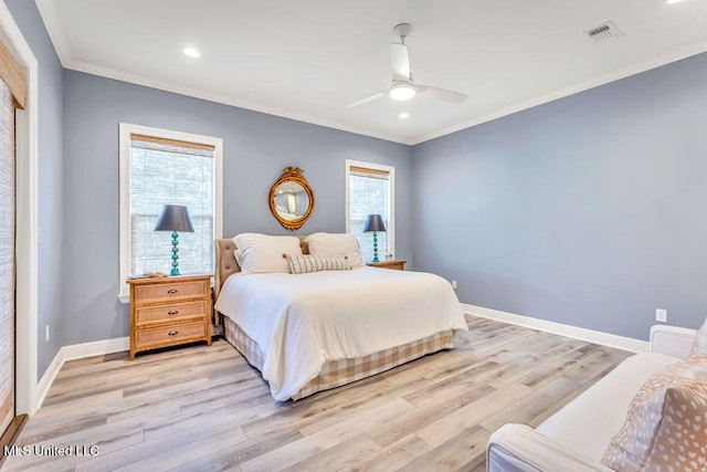 bedroom with light hardwood / wood-style floors, crown molding, and ceiling fan