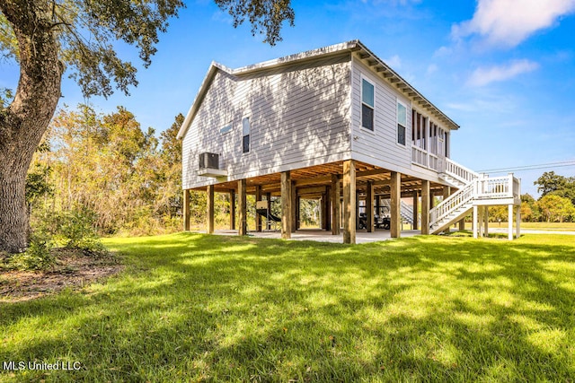 rear view of property with a lawn