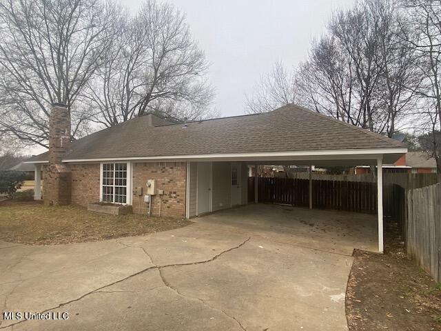 view of home's exterior with a carport