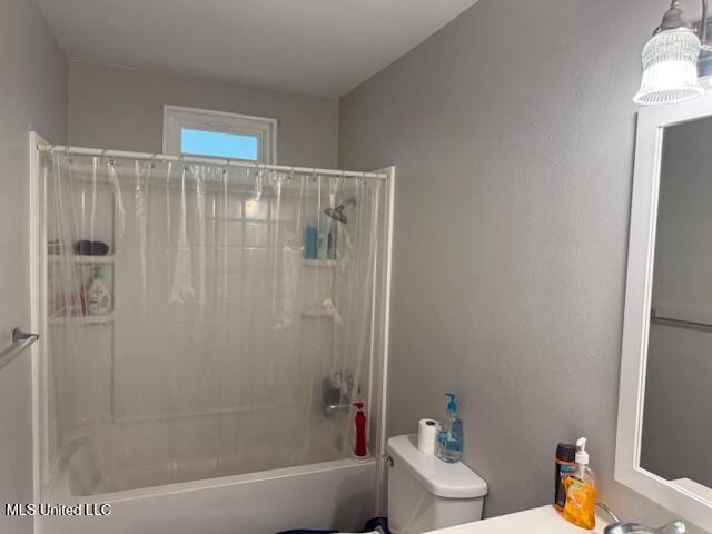 full bathroom featuring vanity, shower / bath combination with curtain, and toilet