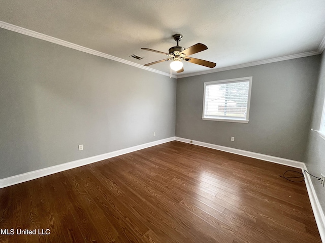 empty room featuring crown molding, dark hardwood / wood-style floors, and ceiling fan